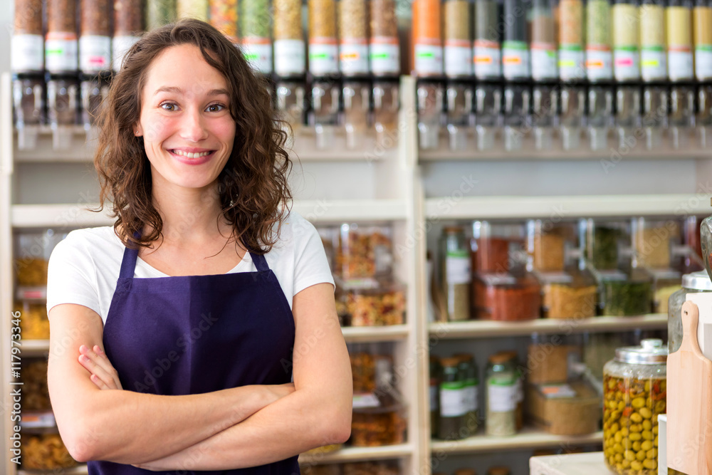 Young attractive woman working at the grocery store